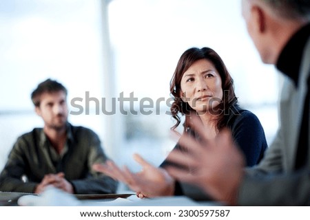 Business people talking in meeting Royalty-Free Stock Photo #2300597587