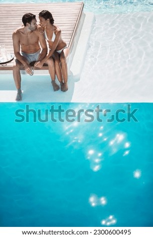 Couple relaxing together at poolside