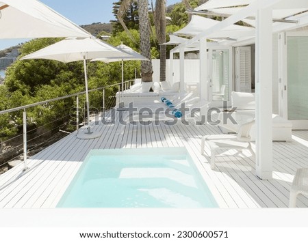 Swimming pool and lounge chairs on patio