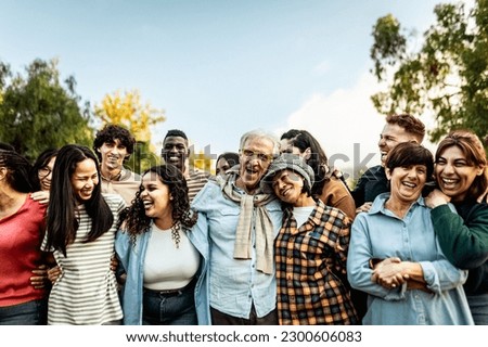 Happy multigenerational people having fun together in a public park - Diversity concept Royalty-Free Stock Photo #2300606083