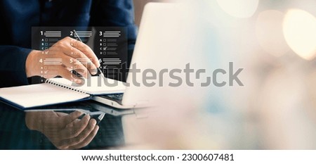 assessment survey online. Businessman with evaluating questionnaire on online laptop computer. choose correct answer in test, questions test, online exam, quiz knowledge, filling out an survey form.