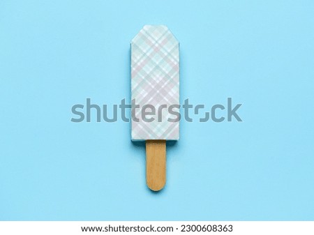 Ice cream in package and stick on blue background
