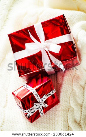 Christmas gifts on knit white background. tinting. selective focus
