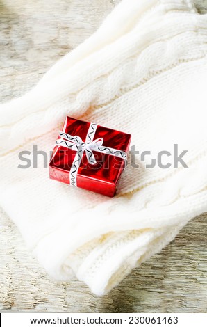 Christmas gifts on knit white scarf. tinting. selective focus on gift
