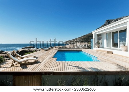 Luxury swimming pool with ocean view Royalty-Free Stock Photo #2300622605