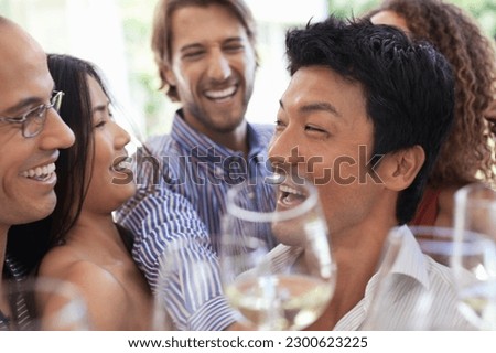 Friends toasting each other at party Royalty-Free Stock Photo #2300623225