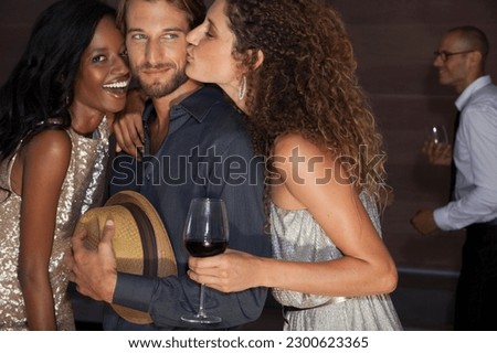 Friends relaxing together at party Royalty-Free Stock Photo #2300623365
