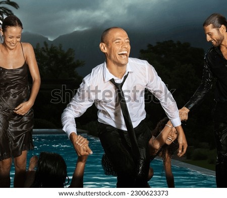 Fully dressed friends playing in swimming pool Royalty-Free Stock Photo #2300623373