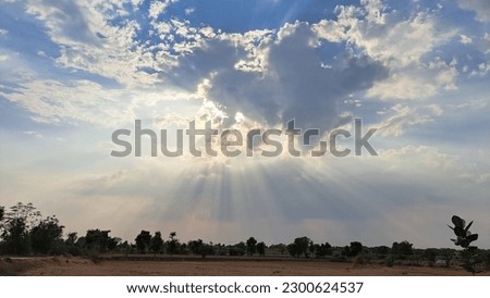 sun during the cloudy sky, and at this time amazing sun Rays come from clouds. Royalty-Free Stock Photo #2300624537
