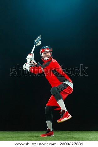 Lacrosse player, athlete in action. Download photo for sports betting advertisement. Sports and motivation vertical photo.