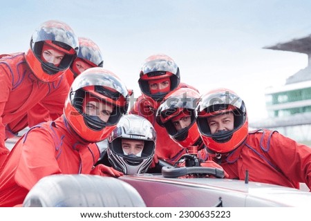 Race car team at pit stop Royalty-Free Stock Photo #2300635223
