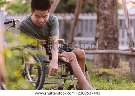 Asian young man with happiness exercise and playing in garden of park or home, hospital, school, nursery with green nature background at sunset, Positive photography and Good mental health concept.