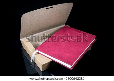 Best gift for men. Man gift concept. Various notebooks with craft gift box on black background. Copy space for text. Valentine's day, wedding, birthday and special occasion gift concept. Copy space 