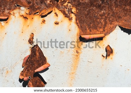 Cracked paint on metal surface. Metal texture with rust Royalty-Free Stock Photo #2300655215