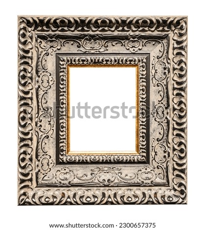 very wide carved silver picture frame isolated on white background with cut out canvas