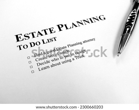 Written Estate Planning to do list on desk with pen Royalty-Free Stock Photo #2300660203