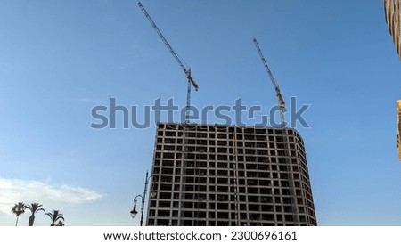A picture of the process of building residential buildings in Tangier, Morocco.  Building material hoist.