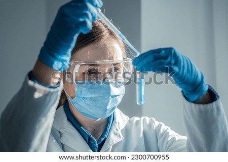 Photo shows chemist working on new technologies in a medical laboratory to improve diagnosis and treatment of diseases. Experiment in biological laboratory to determine effectiveness new medication. Royalty-Free Stock Photo #2300700955