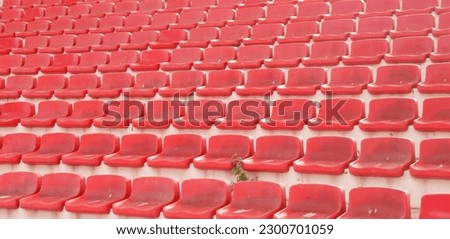 Plastic red color empty stadium bench