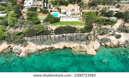 Aerial drone photo of seaside luxury pool resort in tropical exotic island bay