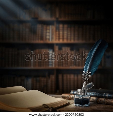Old quill pen with an inkwell, papers and books on a table against an old bookshelf. Concept on the theme of history, education, literature. Retro style. Royalty-Free Stock Photo #2300750803