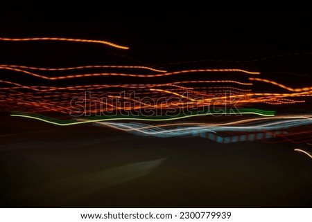 Image of colorful light trails with motion blur effect. Long exposure isolated on background.
