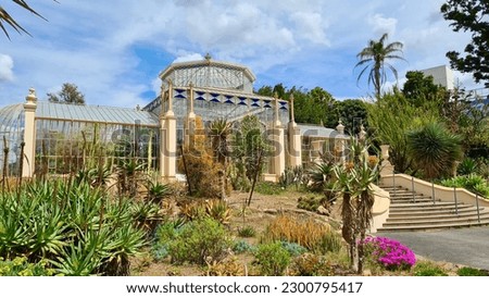 A beautiful historical stained glass greenhouse in the Adelaide Botanic Garden  Royalty-Free Stock Photo #2300795417