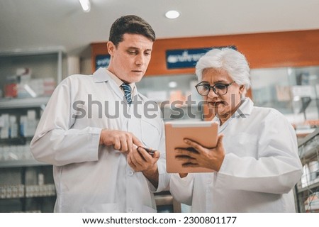 skilled pharmacist is consulting, analyzing the use of drugs to recommend and supervise patients according to prescriptions in modern pharmacies. Royalty-Free Stock Photo #2300801177