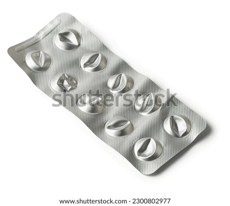 close-up of used empty pill blister pack, discarded silver medicine packs made of plastic and aluminum foil and not biodegradable, isolated on white background, disposal and recycling concept Royalty-Free Stock Photo #2300802977