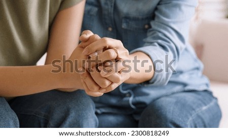 Middle aged asia people old mom holding hands trust comfort help young woman talk crying stress relief at home. Mum as friend love care hold hand adult child feel pain sad worry of life crisis issues. Royalty-Free Stock Photo #2300818249