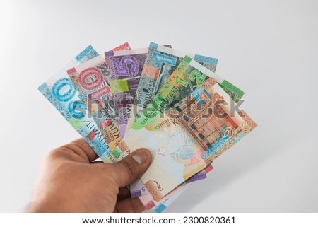Selective focused , Full set of Kuwaiti Dinar bank paper notes. Kuwait dinar bank notes 0.25KWD, 0.5KWD, 1KWD, 5KWD, 10 KWD and 20 KWD.  Royalty-Free Stock Photo #2300820361