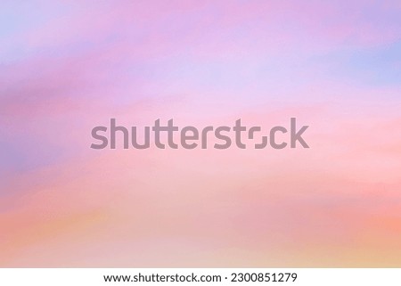 Sky with soft and fluffy pastel orange pink and blue colored clouds. Sunset background. Nature. sunrise. 