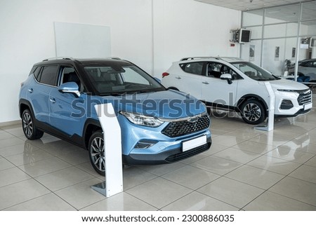 New auto in dealer showroom, nobody. Modern transportation for sale or rent Royalty-Free Stock Photo #2300886035