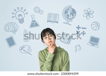 Young Asian girl and school subjects concept.