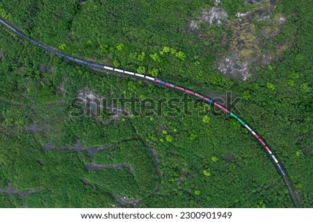 Aerial view of container Freight Train. Royalty-Free Stock Photo #2300901949