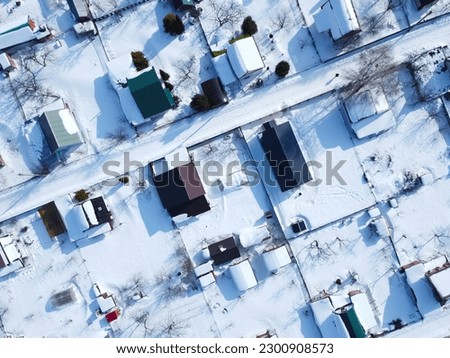 Snow in the village. Togliatti city Aerial view. Top view of houses