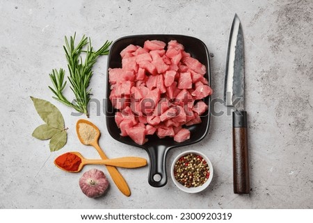 Top view of raw pork goulash in ceramic pan Royalty-Free Stock Photo #2300920319