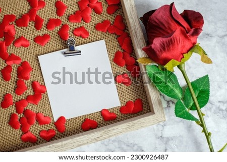 Valentines day background. Red rose with message card of Love romantic couple