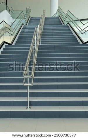 Modern staircase leading upstairs office building - Stock photo