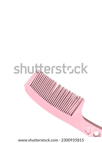 Pink comb with love stalk on white background