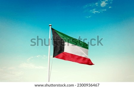 Waving flag of Kuwait in beautiful sky. Kuwait flag for independence day. Royalty-Free Stock Photo #2300936467