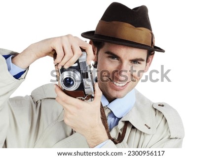 Detective, photographer and portrait with man in studio for surveillance, reporter and investigation. Photography, press and secret with agent on white background for vintage, paparazzi or journalist