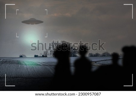 UFO, alien and camcorder on a camera display to record a flying saucer in the sky over area 51. Viewfinder, sighting and conspiracy with a spaceship on a recording device screen outdoor in nature Royalty-Free Stock Photo #2300957087