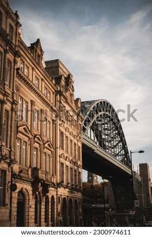 The Tyne Bridge against the beautiful building in Newcastle Royalty-Free Stock Photo #2300974611