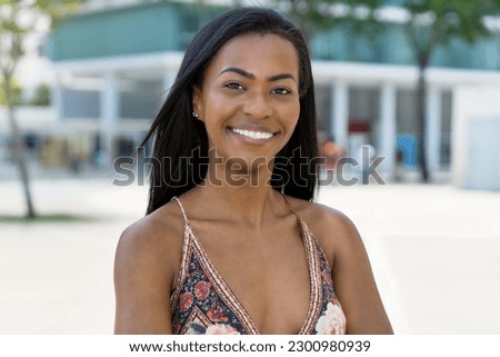 Laughing south american woman with tradtional clothes outdoor in summer in city Royalty-Free Stock Photo #2300980939