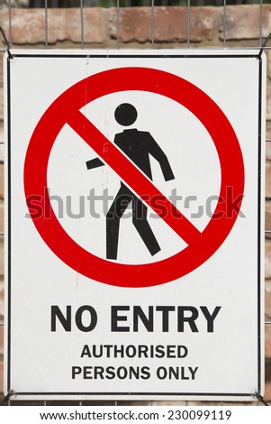 No entry sign on construction site fence to indicate restricted access to private property for security reason, blurred background outdoor.