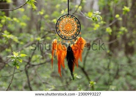 Dream catcher with feathers threads and beads rope hanging. Dreamcatcher handmade Royalty-Free Stock Photo #2300993227