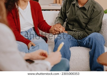 group therapy of couple psychologist moral support and mental health. close up of hands and handshakes at session psychotherapist. women and men care for support each other. depression and addiction Royalty-Free Stock Photo #2301000353