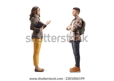 Female teacher talking to a male teenage student isolated on white background