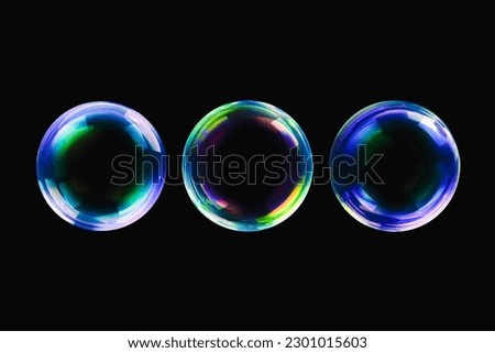 BUBBLES ISOLATED ON BLACK BACKGROUND, GLOWING AIR BALLS ON DARK BACKDROP